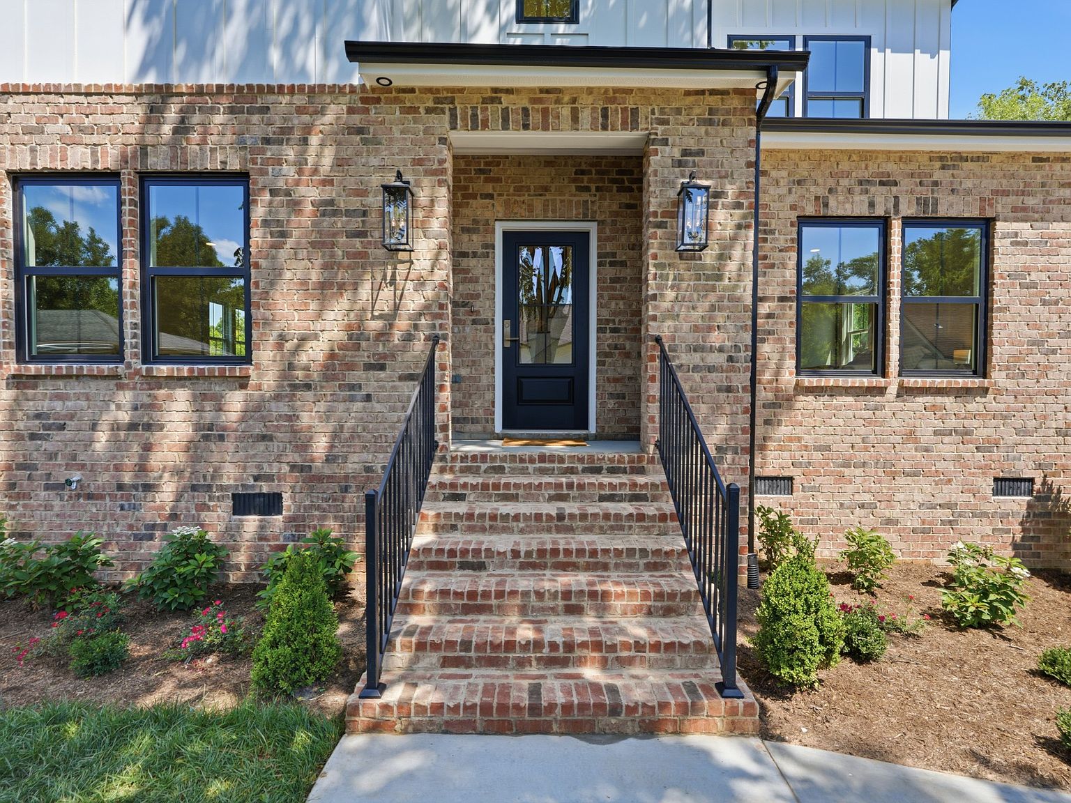 Brick entry steps and covered portico at the front door